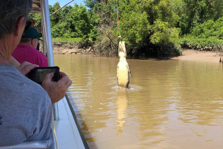 a man sitting on a boat in the water