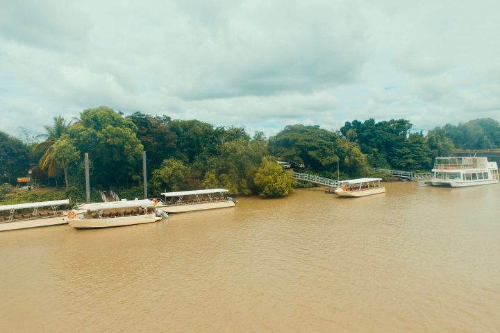 a boat is docked next to a body of water