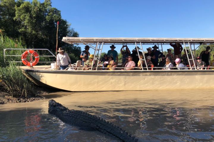 a group of people in a boat on a body of water