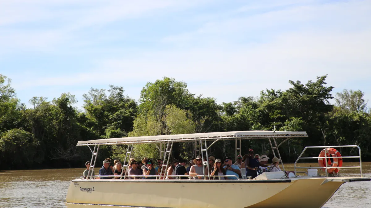 a group of people on a boat in the water